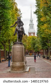 Boston, Massachusets / USA - 10 24 2015: Paul Revere statue with bronze horse at Paul Revere Mall in Boston with the Old North Church in the background