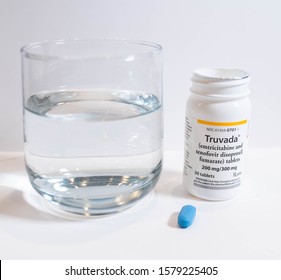 BOSTON, MASSACHUSETTS; DECEMBER 3, 2019 : Glass Of Water With Truvada PrEP Pill For Pre-Exposure Prophylaxis.