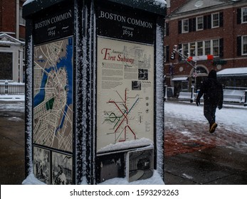 Boston Massachusetts, December 3rd, 2019: A Map And Subway Map With A Sidewalk And A Man Walking In The Snow.