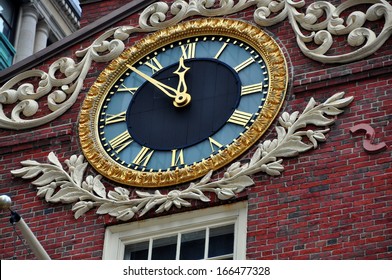 BOSTON, MASSACHUSETTS:   A Handsome Clock Adorns The Facade Of The Historic 1713 Old State House At The Corner Of State And Washington Streets Is A Landmark Site On The Freedom Trail