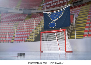 Boston, Massachusetts - June 11, 2019: Illustrative Editorial render of the St Louis Blues NHL flag above a goal with a hockey puck in the foreground. Bruins play the Blues for Stanley Cup Finals 