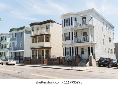 BOSTON, MASSACHUSETTS - JUNE 14, 2018: Real Estate Background Showing Triple Decker Houses And Condos In Dorchester, Boston.