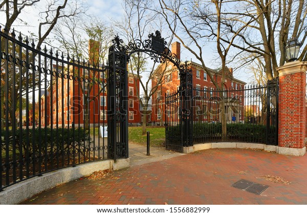 Boston Massachusetts - November 10, 2019: The\
Entrance gate of Harvard Yard on campus of Harvard University at\
sunrise. Harvard University is a private Ivy League research\
university in Cambridge,\
MA.