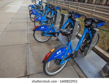 Boston. Massachusetts / USA - 12/26/2019: Public Bicycles For Rental Rides With The Blue Cross Blue Shield Logo.