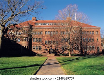 Boston, Massachusetts, USA - November 1, 2006: Autumnal and front view of a law school building at Harvard University with trail and green grass
