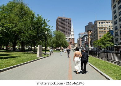 Boston, Massachusetts, USA-June 4, 2022 People walking along a path in Boston Common 