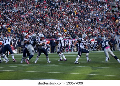 BOSTON - OCTOBER 16: Quarterback Tom Brady, No 12, throws pass at Gillette Stadium, New England Patriots vs. Dallas Cowboys on October 16, 2011 in Foxborough, Boston, MA