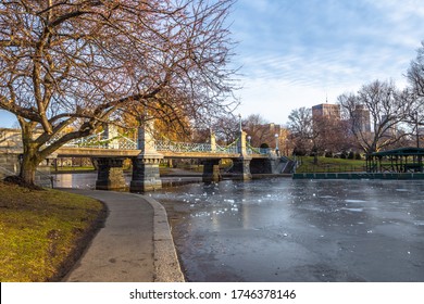 Boston Public Garden Bridge in Boston Public Garden with blue sky background in winter.