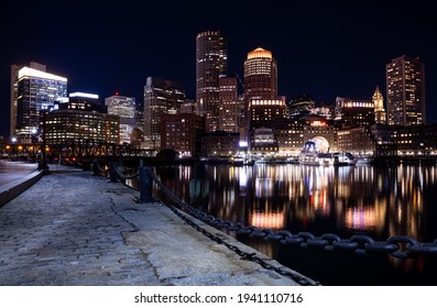 Boston seaport at night with river walk