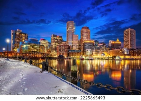 Boston skyline, financial district and harbor at winter night