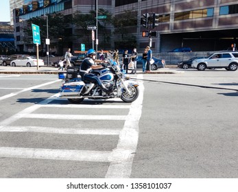 Boston, USA 09 22 2012: Officer Or Cop Of The Police Special Operations Unit Riding His Harley Davidson Motorcycle On Traffic Enforcement And Crowd Control Patrol Downtown In The City, Motion Blur