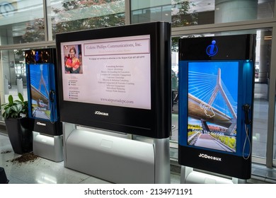 Boston, USA - July 11, 2019 : Advertising on touch screen and Telephone booth public at Logan International Airport in Boston, USA.