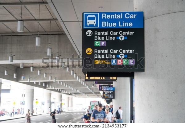 Boston, USA - July\
11, 2019 : Signs Rental car blue line at Logan International\
Airport in Boston, USA.