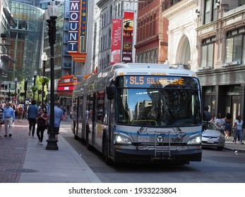 Boston, USA - June 15, 2019: Bus Of The Massachusetts Bay Transportation Authority Driving Around In Downtown Boston.