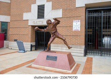 BOSTON, USA - MAY 2, 2021: Doug Flutie The Hail Mary Pass Statue In Front Of Alumni Stadium Main Entrance In Boston College, Chestnut Hill, Newton, Massachusetts MA, USA.