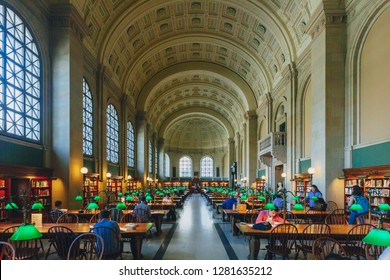 Boston, USA - May 27, 2016: Locals study and read books in the Reading Room at McKim Building of Boston Public Library