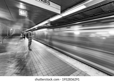 BOSTON, USA - SEP 13, 2017: People Enter The Red Line Train In The Oldest Subway In The US.