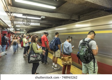 BOSTON, USA - SEP 13, 2017: People Enter The Red Line Train In The Oldest Subway In The US.