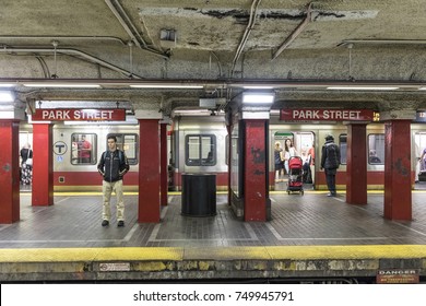 BOSTON, USA - SEP 13, 2017: People Enter The Red Line Train In The Oldest Subway In The US.