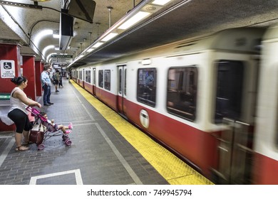 BOSTON, USA - SEP 13, 2017: People Enter The Red Line Train In The Oldest Subway In The US.