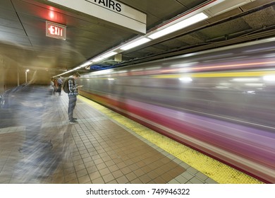 BOSTON, USA - SEP 13, 2017: People Enter The Red Line Train In The Oldest Subway In The US.