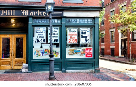 BOSTON-MAY 30, 2010: Old Fashioned Corner Grocery Store In The Historic Beacon Hill Neighborhood, Where Buildings And Sidewalks Are Still Constructed Of Red Brick And A Gas Street Lamp Flickers.