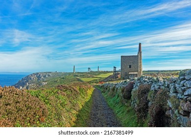Botallack, Cornwall, UK, July 11th, 2019, The Southwest coastal footpath passing near the ruins of the mine workings with the Wheal Owles Engine House in the foreground.