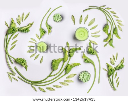 Green flowers and leaves flat lay