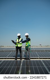 Both of Engineer in charge of solar panel installation The installation of solar energy conversion into electricity for a warehouse is currently being investigated.