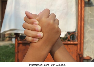 Both Hands Intertwined. Shake Hands. Child's Hand.