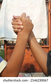 Both Hands Intertwined. Shake Hands. Child's Hand.