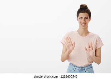 Bothered Polite Young Female Coworker Rejecting Creepy And Disgusting Offer Looking Intense And Awkward Waving Palms In No, Refusal Gesture Frowning And Smiling Nervously From Aversion And Dislike