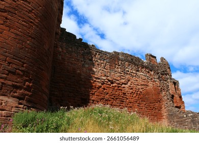 Bothwell castle , from the side in colour with clouds in background 