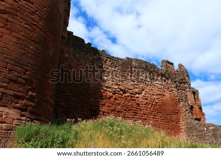 Bothwell castle , from the side in colour with clouds in background 