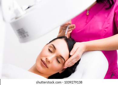 Botox Hair Close-up, A Doctor Injects A Botox Injection Into The Hair Of A Young Patient