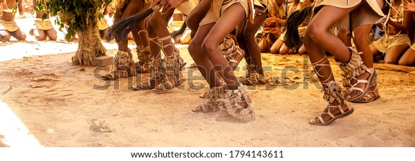 Botswana\
Traditional Dance Students Dancing To The Beat of Claps and Song In\
Khoisan Attire During A Ceremony Putting On Leg Rattles and Holding\
Traditional Whisk Made From Horse Tail\
Hair.