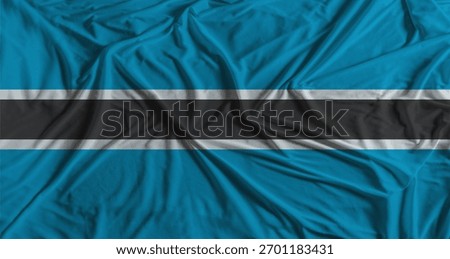 Botswanan flag with fabric texture background. National flag of Botswana with cloth texture