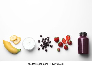 Bottle Of Acai Drink And Ingredients On White Background, Top View