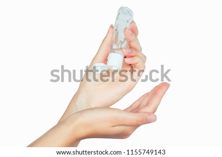 bottle with antibacterial antiseptic gel in hand on white isolate