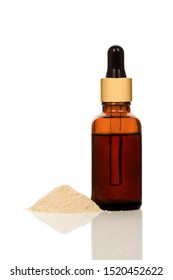 Bottle Of Ashwagandha Extract And Powder Isolated On White Background. Adaptogen Concept.