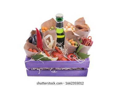 A bottle of beer with nuts and crackers. Boiled cancer, squid. Gift set for beer lovers. Beer after the bath.