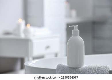 Bottle Of Bubble Bath And Towel On Tub In Bathroom, Space For Text