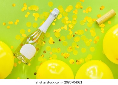 Bottle Of Champagne With Balloons And Confetti On Color Background