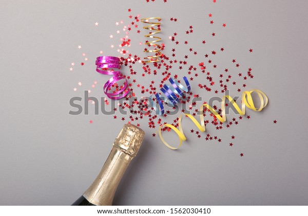 Bottle Champagne Confetti On Colored Background Stock Photo 1562030410 