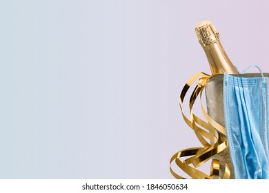 Bottle of Champagne with Gold Confetti and Protective Face Mask - Shutterstock ID 1846050634