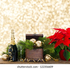 bottle of champagne and two glasses on shiny lights background. festive new years decoration - Powered by Shutterstock