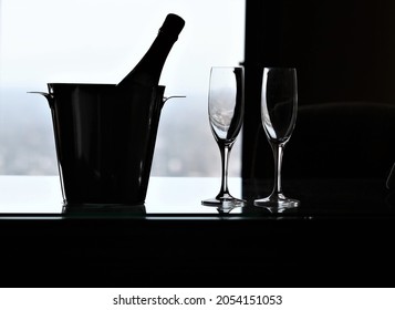 Bottle of Champaign in Ice bucket with two Champaign glasses
