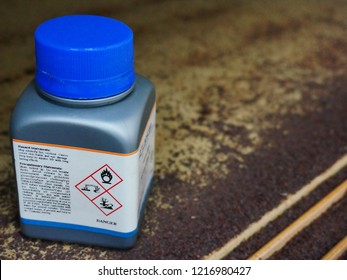 Bottle Of Chemical With Warning Reactivity Hazardous Dangerous Label,
Oxidizing Agent, Harmful By Inhalation And In Contact With Skin, Very Toxic To Aquatic Organisms. And Effected Of Its Reactivity.