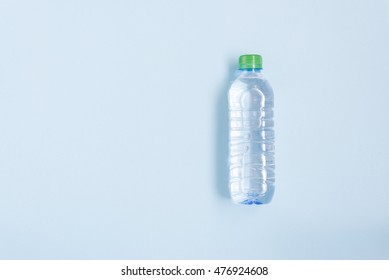 Bottle With Clean Water Over Blue Background, Top View