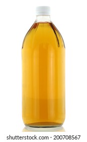 Bottle of clear filtered Apple Cider Vinegar isolated on white background. Mother enzymes have been filtered out.